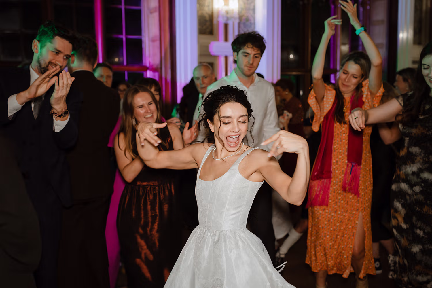 Bride dancing at an evening wedding reception in Aberdeen